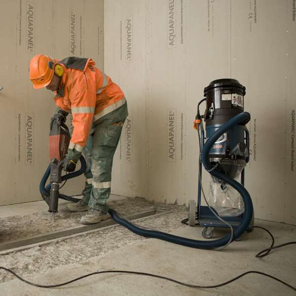 man with dust extractor